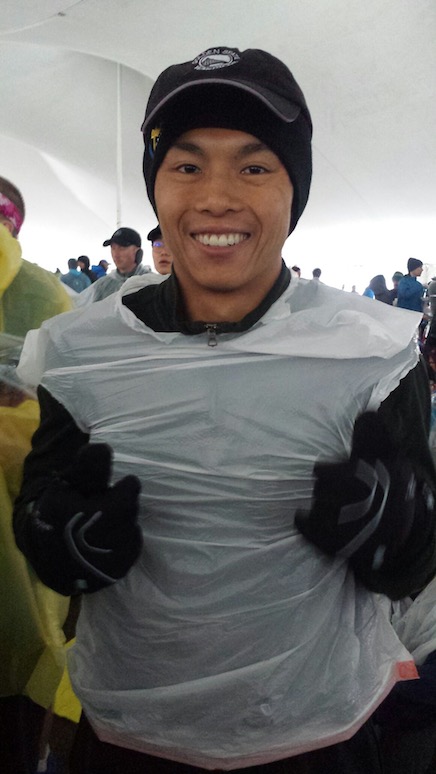 Trying to stay dry and warm at the Athlete's Village before the Boston Marathon