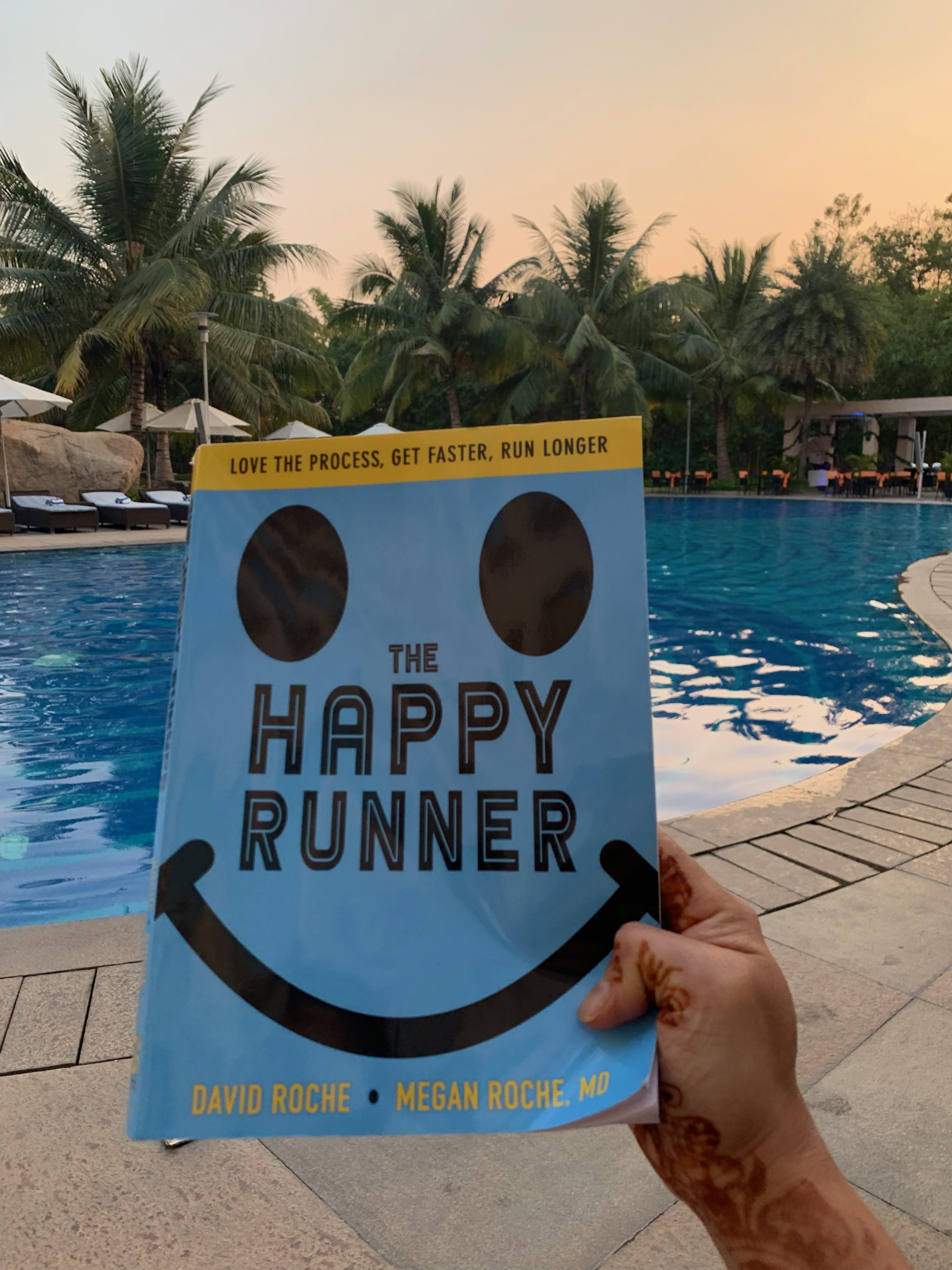 Reading "The Happy Runner" poolside at Shravan and Stuthi's wedding in Hyderabad, December 2018